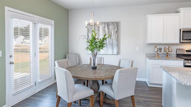 1316 Village Brook Dr, Dacula, GA 30019 - dining space featuring a chandelier and dark wood-style floors