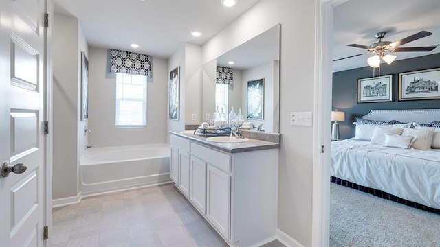 1316 Village Brook Dr, Dacula, GA 30019 - bathroom with a bath, vanity, ensuite bathroom, a ceiling fan, and recessed lighting
