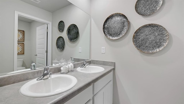 1316 Village Brook Dr, Dacula, GA 30019 - bathroom featuring toilet and double vanity