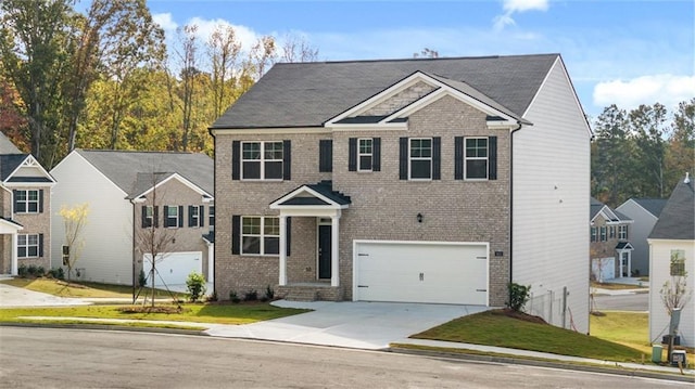 1316 Village Brook Dr, Dacula, GA 30019 - view of front facade featuring brick siding, an attached garage, and driveway