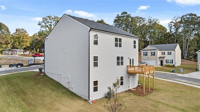 1316 Village Brook Dr, Dacula, GA 30019 - view of side of property featuring a yard, a deck, and view of scattered trees