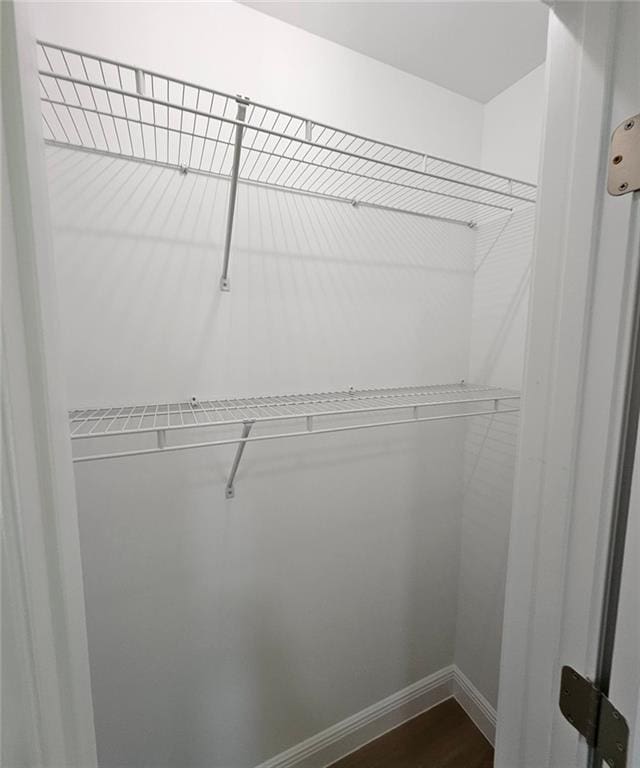 681 Burtons Cv, Hampton, GA 30228 - spacious closet featuring dark wood finished floors