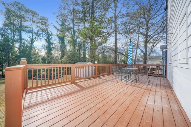 deck with outdoor dining space