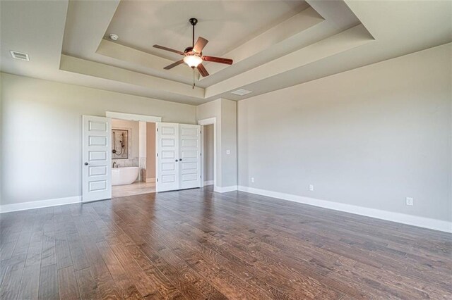 bathroom featuring vanity, a tub to relax in, and hardwood / wood-style floors