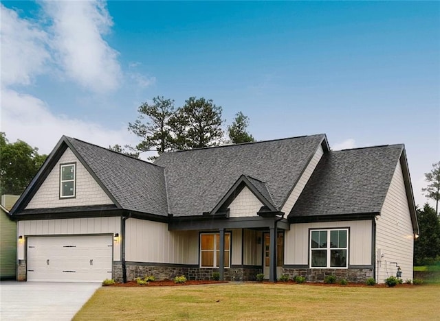 craftsman-style home featuring a garage and a front yard