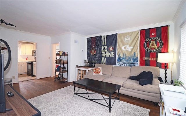 living room featuring hardwood / wood-style flooring and ornamental molding