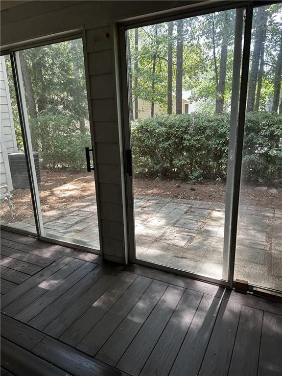 entryway with plenty of natural light and wood-type flooring