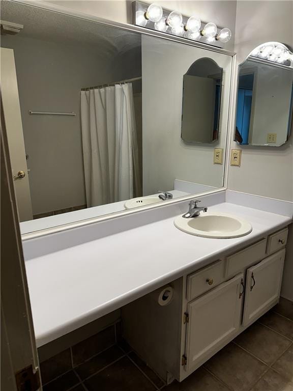 bathroom with tile patterned flooring, vanity, and a shower with shower curtain