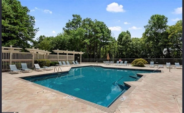 view of swimming pool featuring a patio