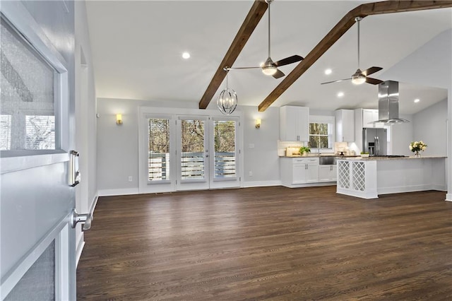 unfurnished living room featuring recessed lighting, baseboards, dark wood-style floors, and vaulted ceiling with beams