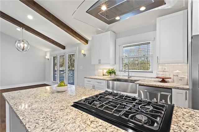 kitchen with light stone counters, lofted ceiling with beams, a sink, white cabinets, and stainless steel dishwasher