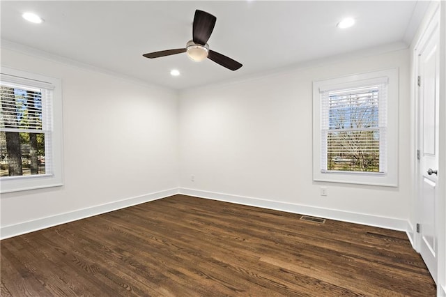 spare room with dark wood-style floors, recessed lighting, baseboards, and ornamental molding