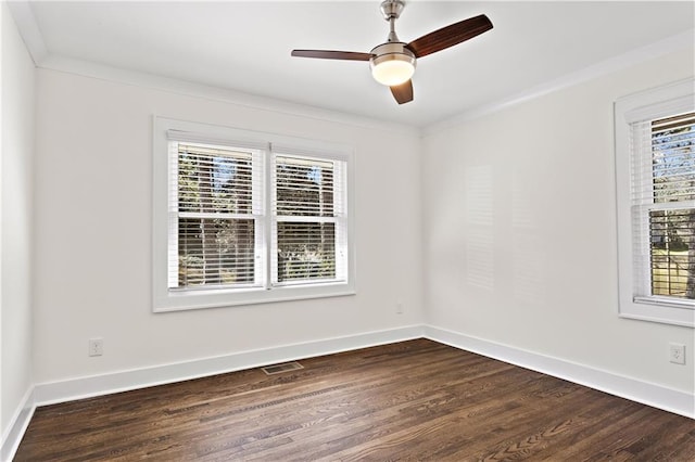 unfurnished room featuring a wealth of natural light, baseboards, and dark wood finished floors