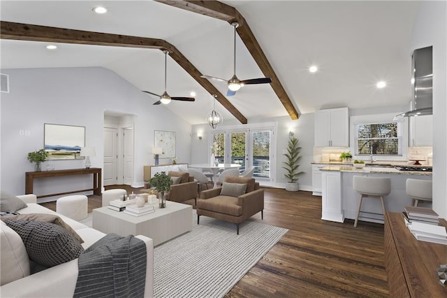 living area featuring beamed ceiling, visible vents, recessed lighting, ceiling fan, and dark wood-style flooring