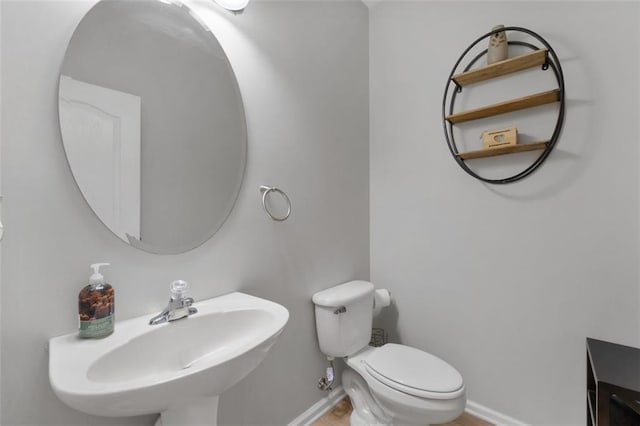 bathroom with toilet and sink