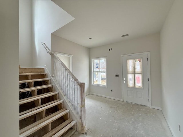 entryway featuring stairway, visible vents, and baseboards