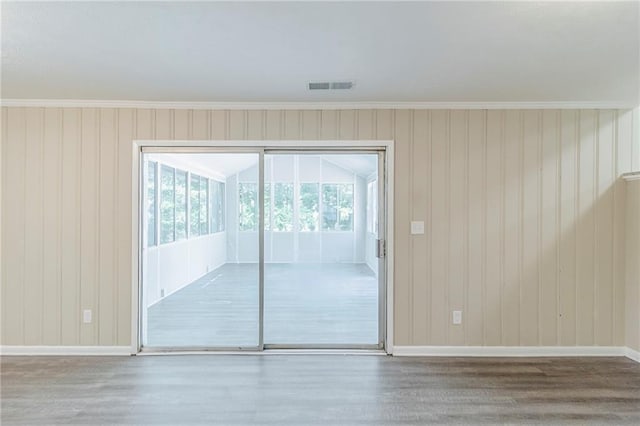 738 Laverne Dr NW, Atlanta, GA 30318 - spare room featuring baseboards, visible vents, and wood finished floors