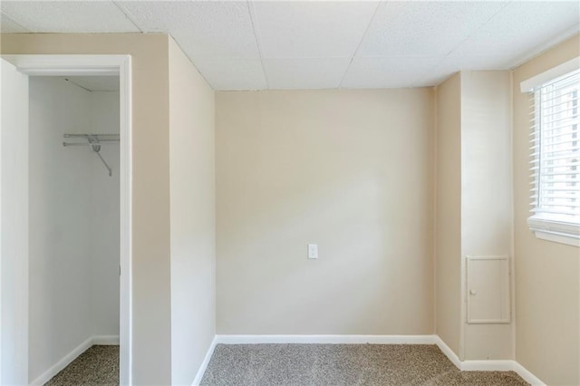 738 Laverne Dr NW, Atlanta, GA 30318 - unfurnished bedroom with a paneled ceiling, a spacious closet, baseboards, and carpet floors