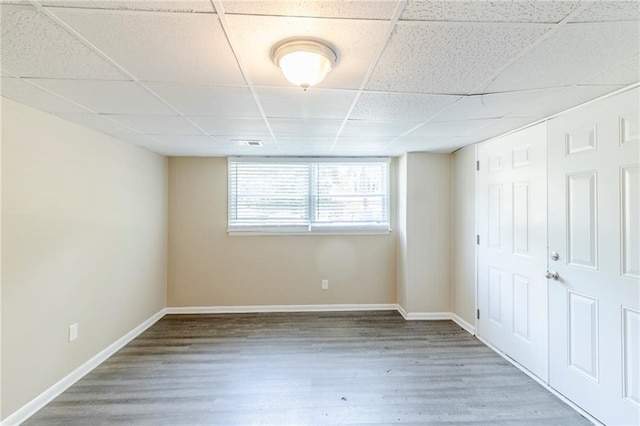 738 Laverne Dr NW, Atlanta, GA 30318 - unfurnished bedroom with a paneled ceiling, visible vents, wood finished floors, and baseboards