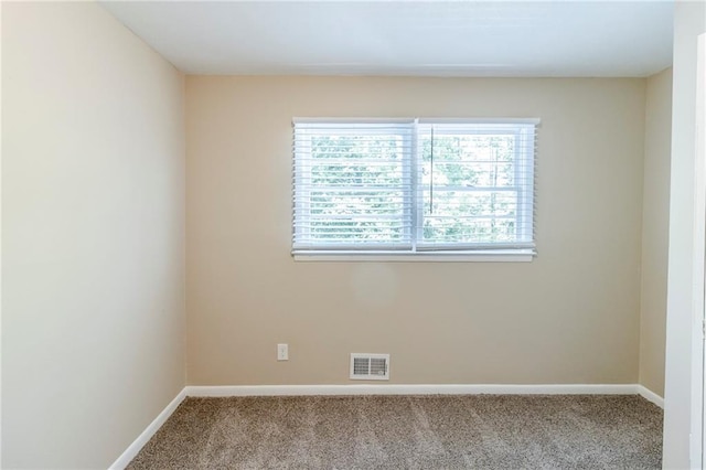 738 Laverne Dr NW, Atlanta, GA 30318 - carpeted spare room with baseboards and visible vents