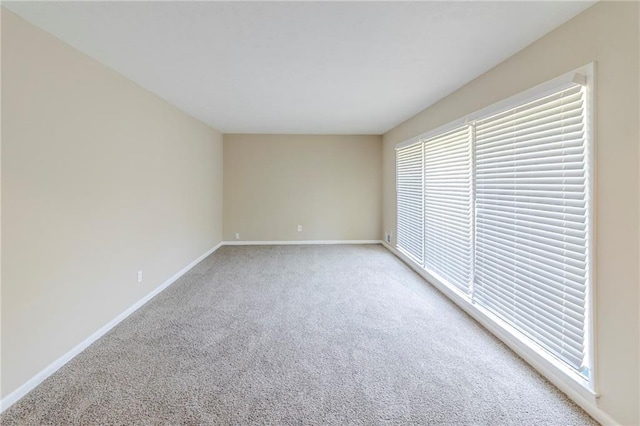738 Laverne Dr NW, Atlanta, GA 30318 - empty room featuring light colored carpet and baseboards