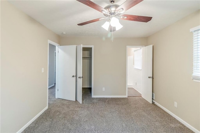 738 Laverne Dr NW, Atlanta, GA 30318 - unfurnished bedroom with a walk in closet, baseboards, a closet, and carpet flooring