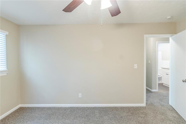 738 Laverne Dr NW, Atlanta, GA 30318 - spare room with baseboards, a ceiling fan, and carpet flooring