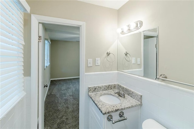 738 Laverne Dr NW, Atlanta, GA 30318 - half bathroom with toilet, tile walls, wainscoting, and vanity