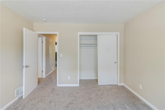 738 Laverne Dr NW, Atlanta, GA 30318 - unfurnished bedroom featuring carpet flooring, a closet, visible vents, and baseboards