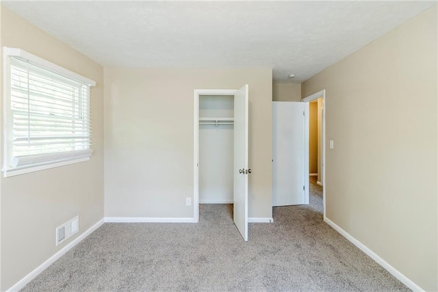 738 Laverne Dr NW, Atlanta, GA 30318 - unfurnished bedroom featuring carpet, visible vents, baseboards, and a closet