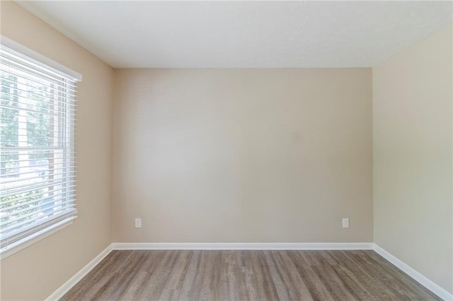 738 Laverne Dr NW, Atlanta, GA 30318 - unfurnished room with baseboards and wood finished floors