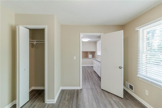 738 Laverne Dr NW, Atlanta, GA 30318 - unfurnished bedroom with a closet, visible vents, baseboards, and light wood-type flooring