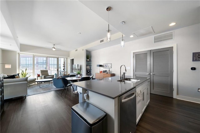 1100 Howell Mill Rd NW Unit 708, Atlanta, GA 30318 - kitchen with stainless steel dishwasher, open floor plan, dark countertops, dark wood-style floors, and white cabinetry