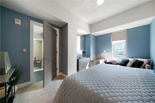1100 Howell Mill Rd NW Unit 708, Atlanta, GA 30318 - bedroom with carpet floors, multiple windows, and a ceiling fan