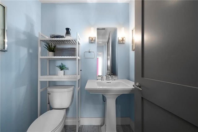 1100 Howell Mill Rd NW Unit 708, Atlanta, GA 30318 - bathroom featuring toilet and baseboards