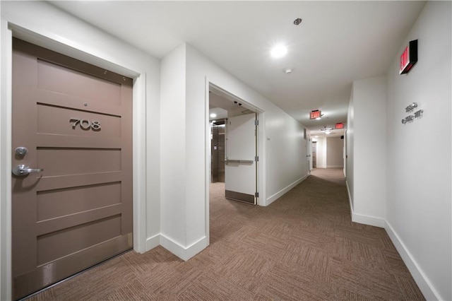 1100 Howell Mill Rd NW Unit 708, Atlanta, GA 30318 - hallway featuring carpet flooring and baseboards