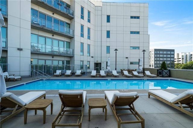 1100 Howell Mill Rd NW Unit 708, Atlanta, GA 30318 - community pool featuring a patio area
