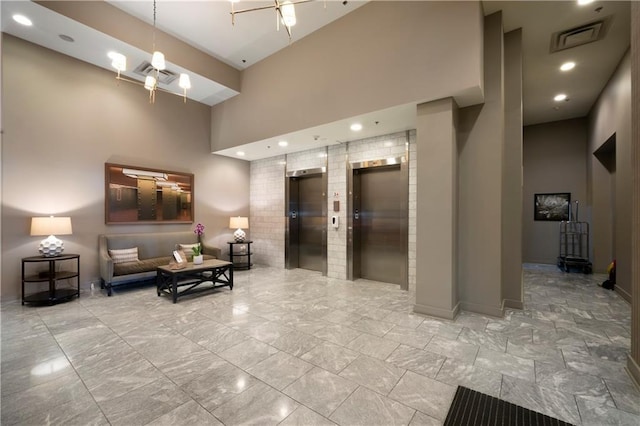 1100 Howell Mill Rd NW Unit 708, Atlanta, GA 30318 - common area with a towering ceiling and recessed lighting