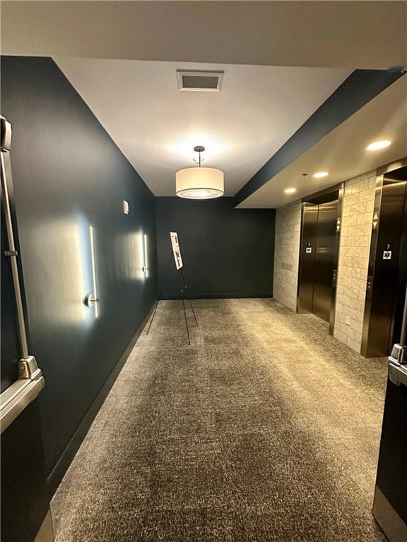 1100 Howell Mill Rd NW Unit 708, Atlanta, GA 30318 - spare room with elevator, recessed lighting, and carpet