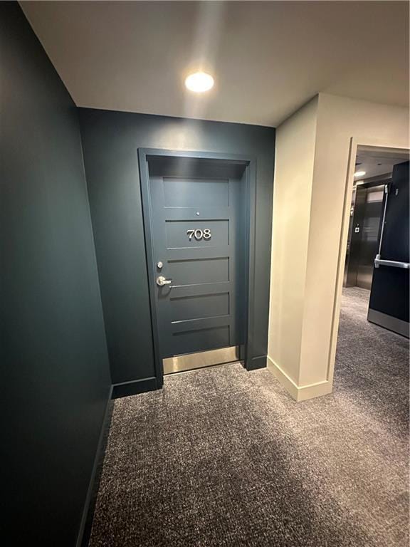 1100 Howell Mill Rd NW Unit 708, Atlanta, GA 30318 - doorway to outside featuring baseboards and carpet flooring