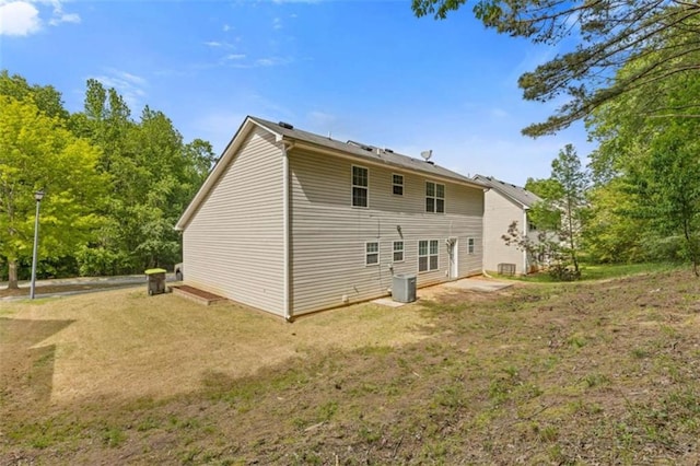 1450 Steam Engine Way, Conyers, GA 30013 - rear view of property featuring a yard and central AC