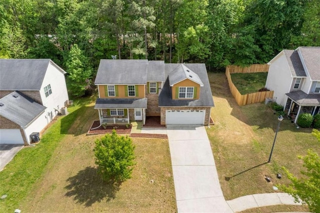 1450 Steam Engine Way, Conyers, GA 30013 - view of front of property featuring covered porch, concrete driveway, and central AC unit