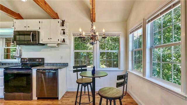 378 Marigold Dr, Menlo, GA 30731 - kitchen with stainless steel appliances, a chandelier, white cabinets, light wood-style flooring, and open shelves