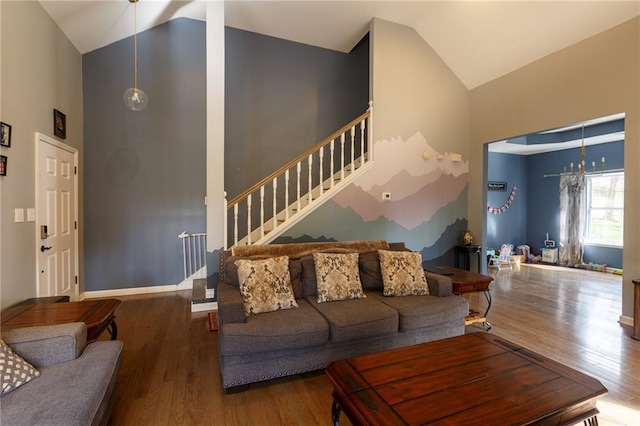 living room featuring hardwood / wood-style floors and high vaulted ceiling