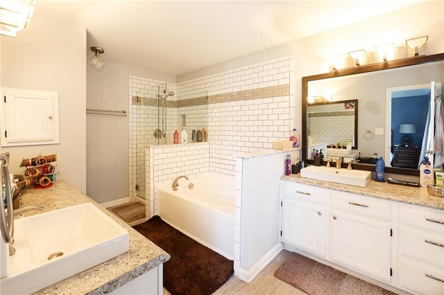 bathroom with vanity and plus walk in shower