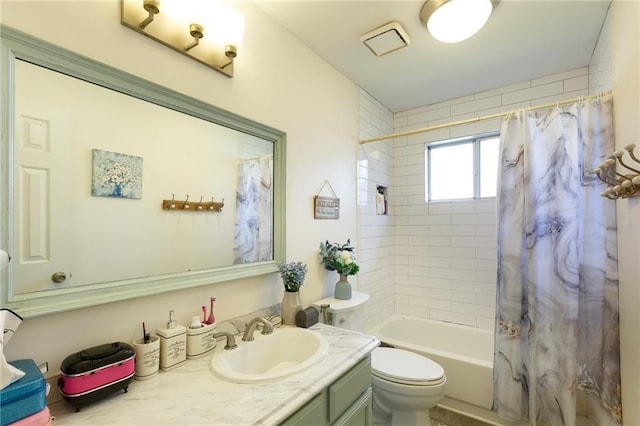 full bathroom featuring shower / bath combination with curtain, vanity, and toilet