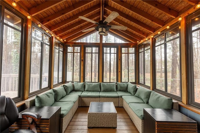 unfurnished sunroom featuring plenty of natural light, vaulted ceiling with beams, and wooden ceiling