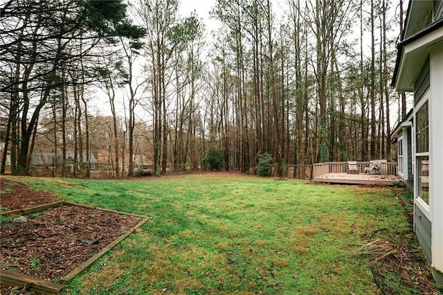 view of yard featuring a deck