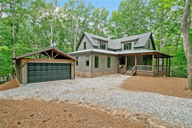 4189 Tamarack Dr, Jasper, GA 30143 - view of front of property featuring a porch, a garage, an outdoor structure, a shingled roof, and view of wooded area