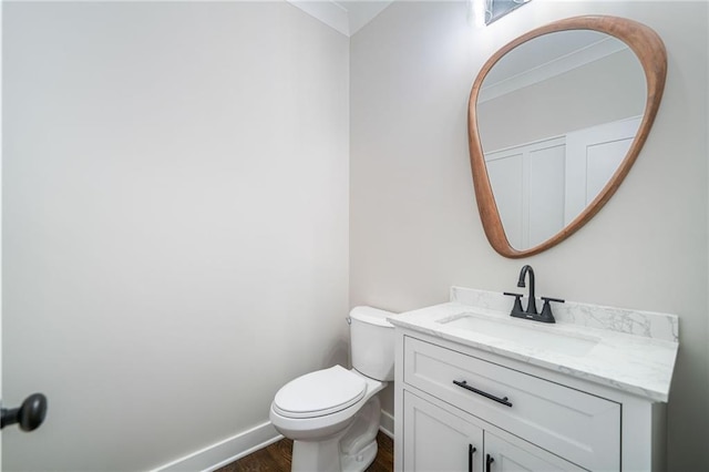 4189 Tamarack Dr, Jasper, GA 30143 - half bath with vanity, wood finished floors, toilet, and baseboards